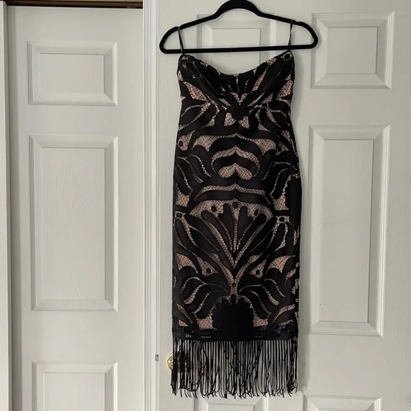 Strapless black lace dress with fringe detail